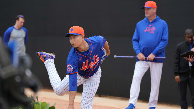 Feb 19, 2024; Port St. Lucie, FL, USA; New York Mets starting pitcher Kodai Senga (34) warms-up during workouts at spring training.